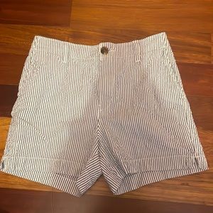 Mid waisted striped linen shorts. Same length as jean shorts, end upper thighs.